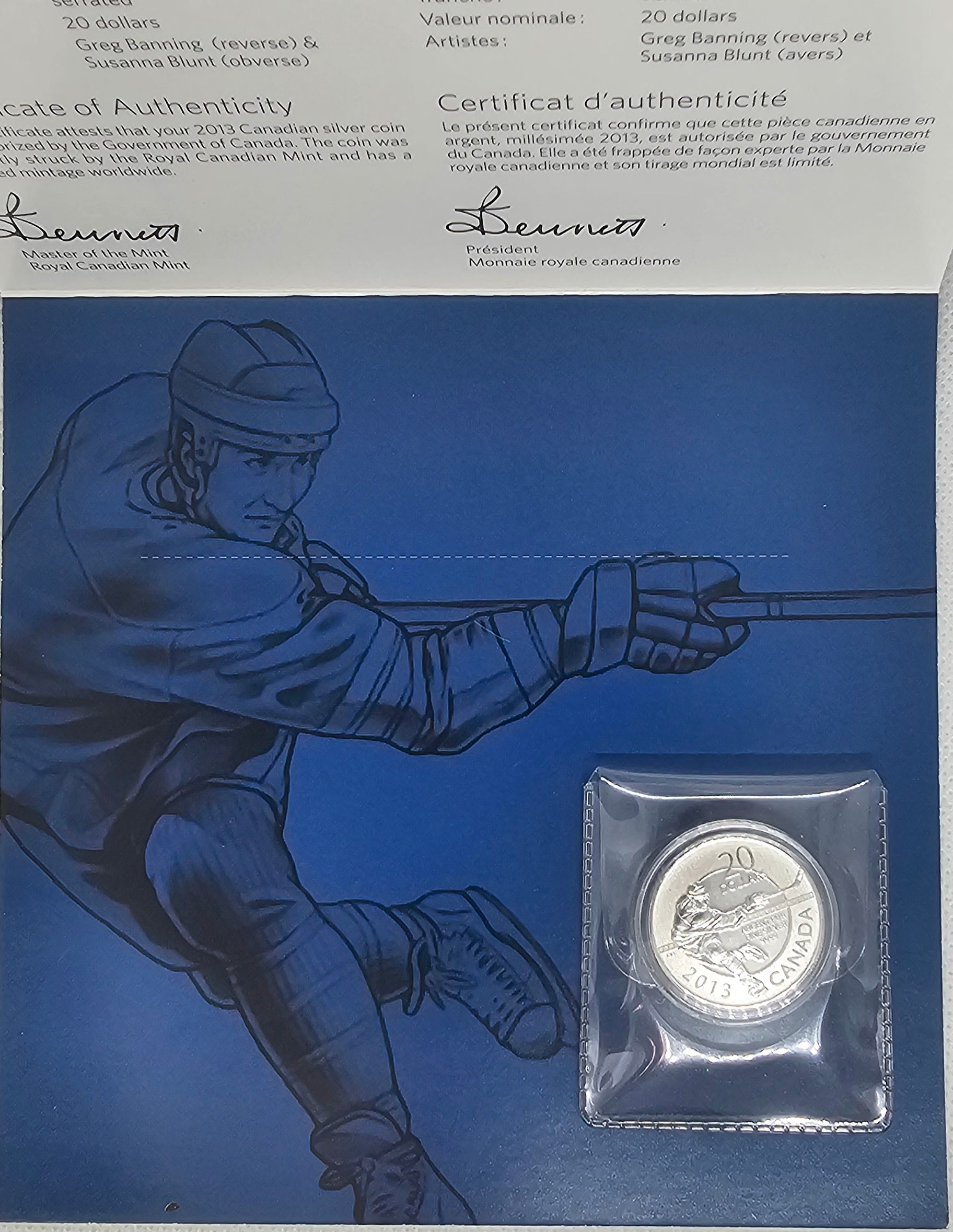 Back panel of 2013 $20 Hockey silver coin packaging featuring blue hockey illustration.