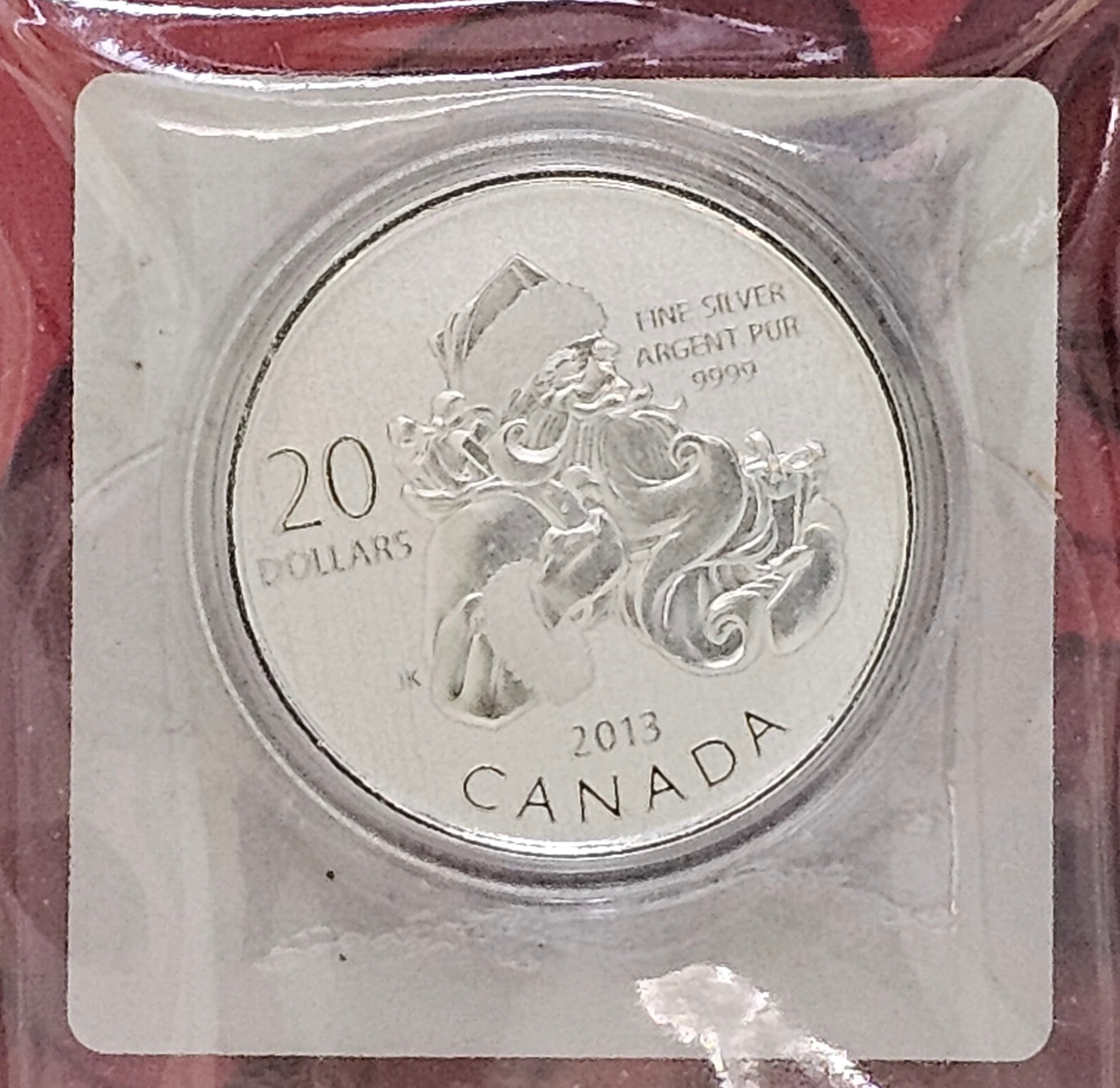 Close-up of 2013 Canada $20 Santa Claus 99.99% fine silver coin in protective capsule.