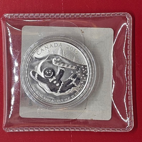 2015 Canada $20 Gingerbread Man fine silver coin sealed inside original mint packaging.