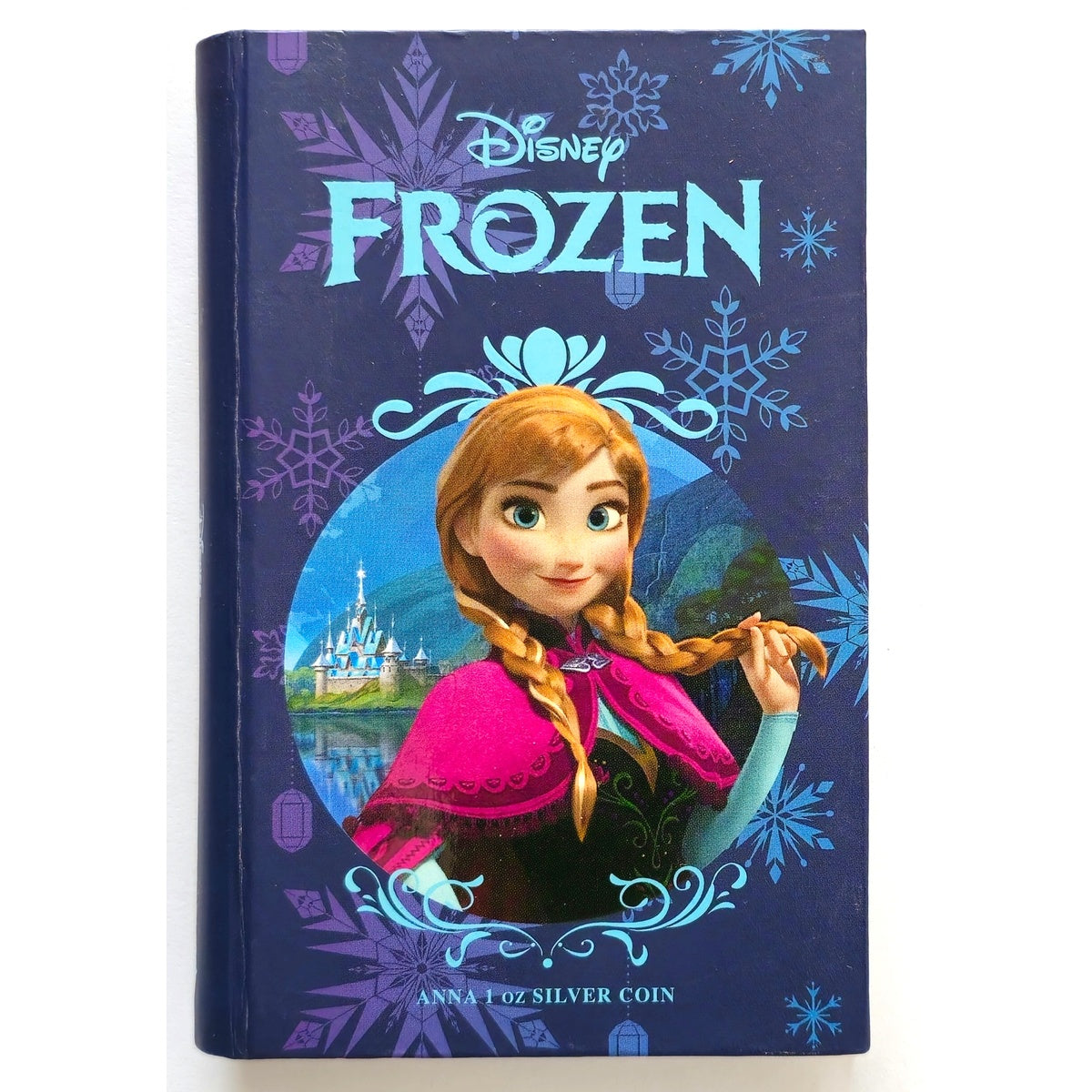 New Zealand Mint Disney Frozen Anna 1 oz silver coin — presentation book cover with Anna portrait.”