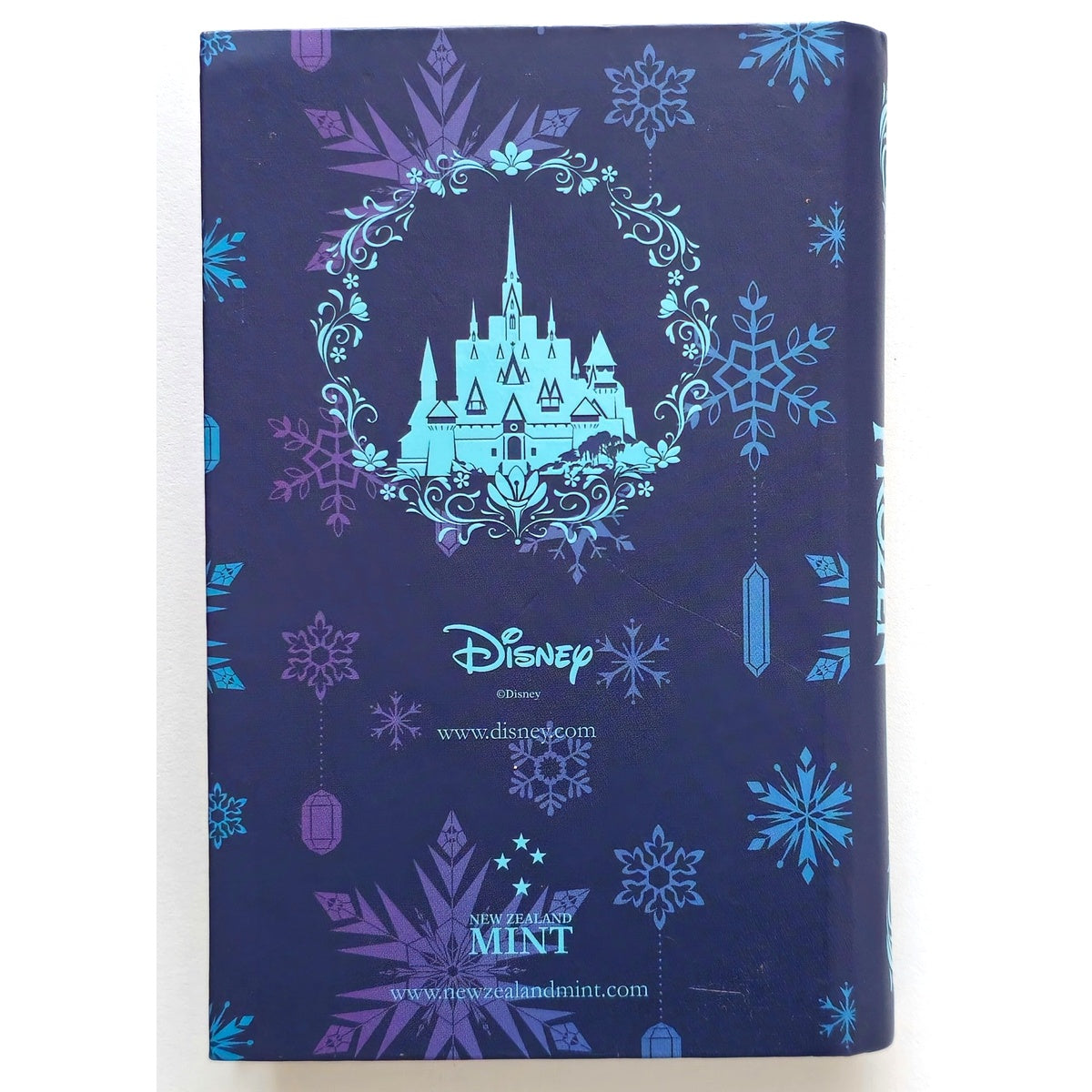 Disney Frozen Anna silver coin packaging — back cover with New Zealand Mint branding.”