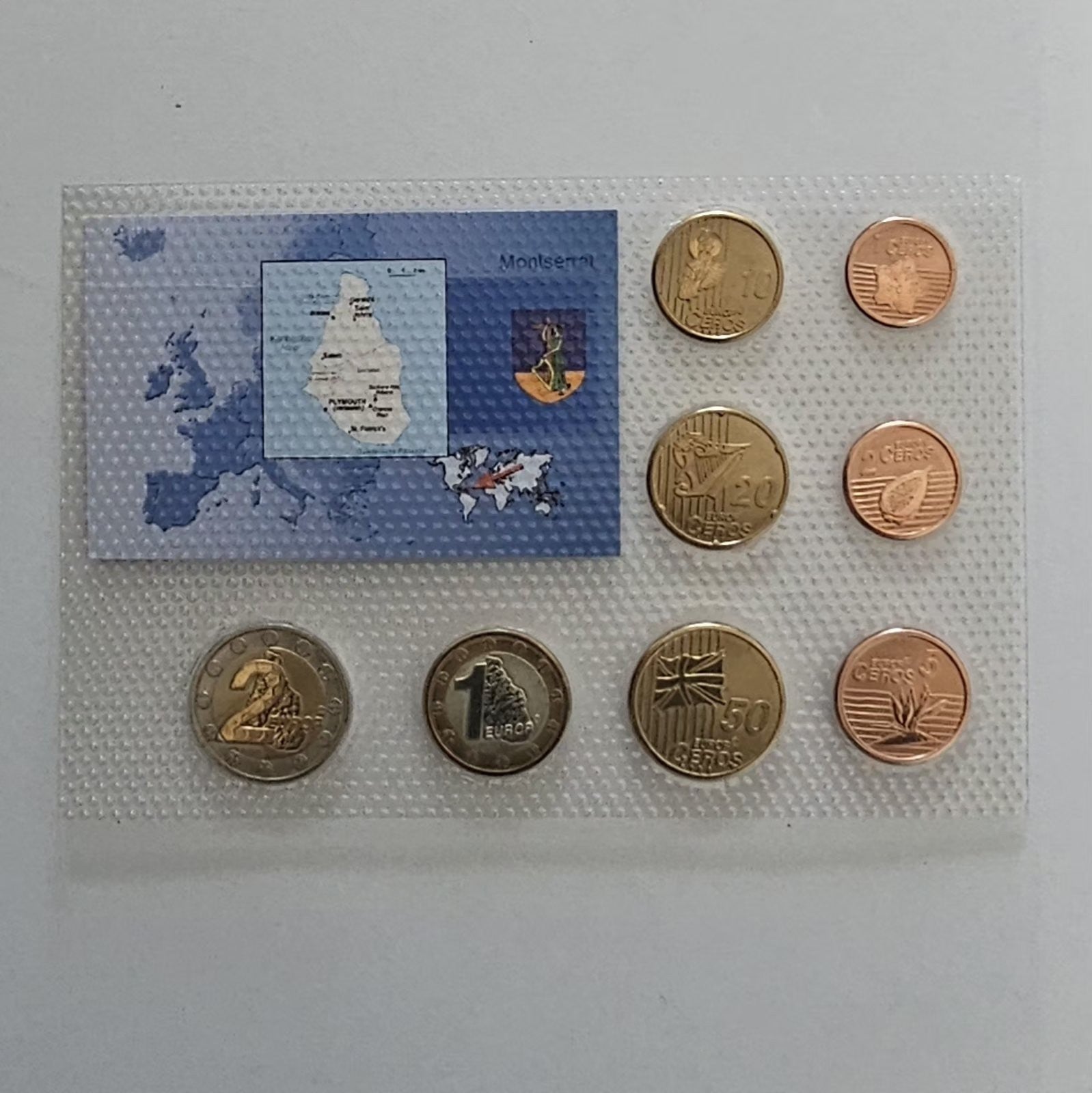 Montserrat euro pattern coins, value sides, card with island map
