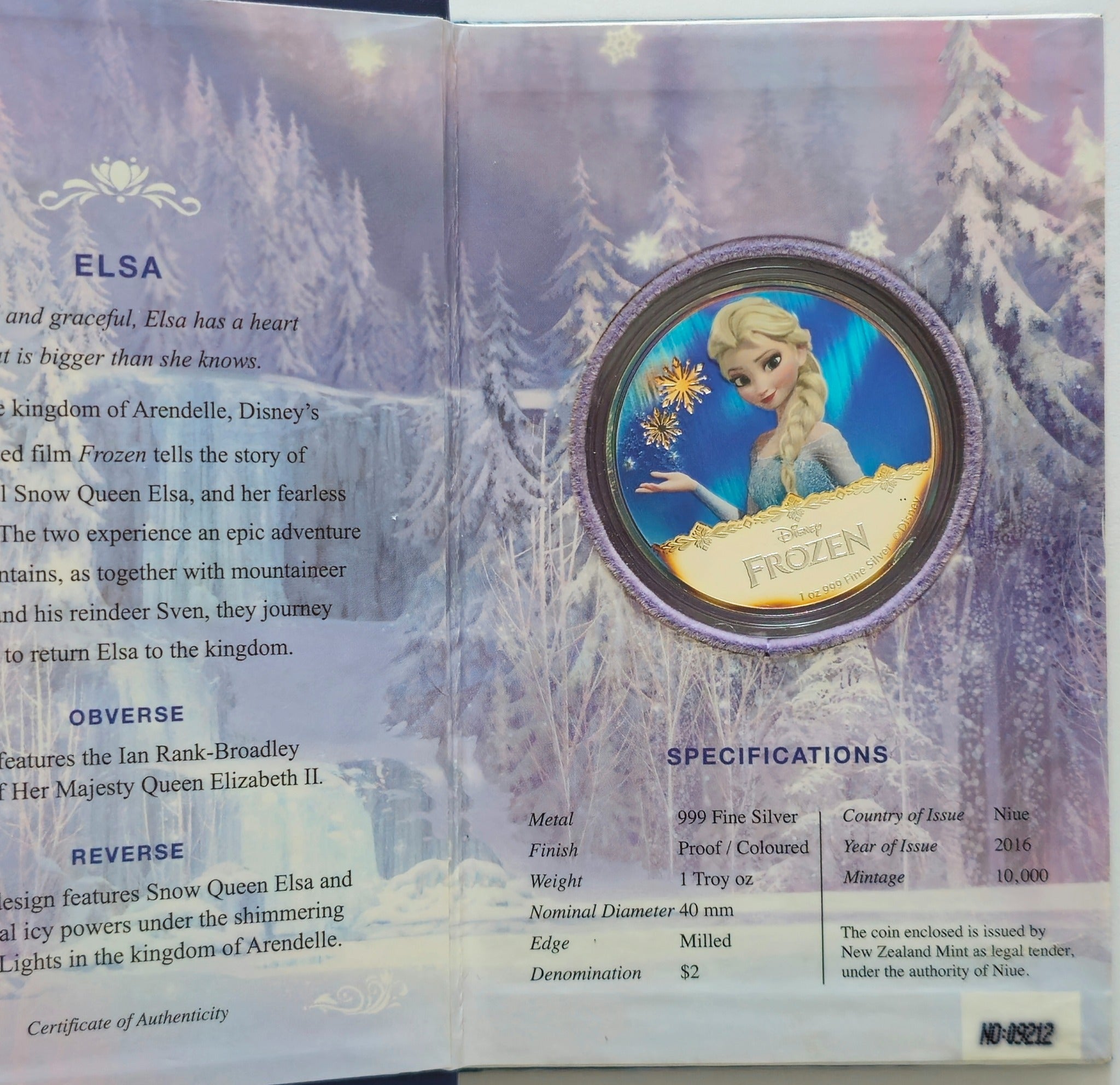 Close-up of Disney Frozen Elsa proof silver coin with colourised design and snowflake details.”